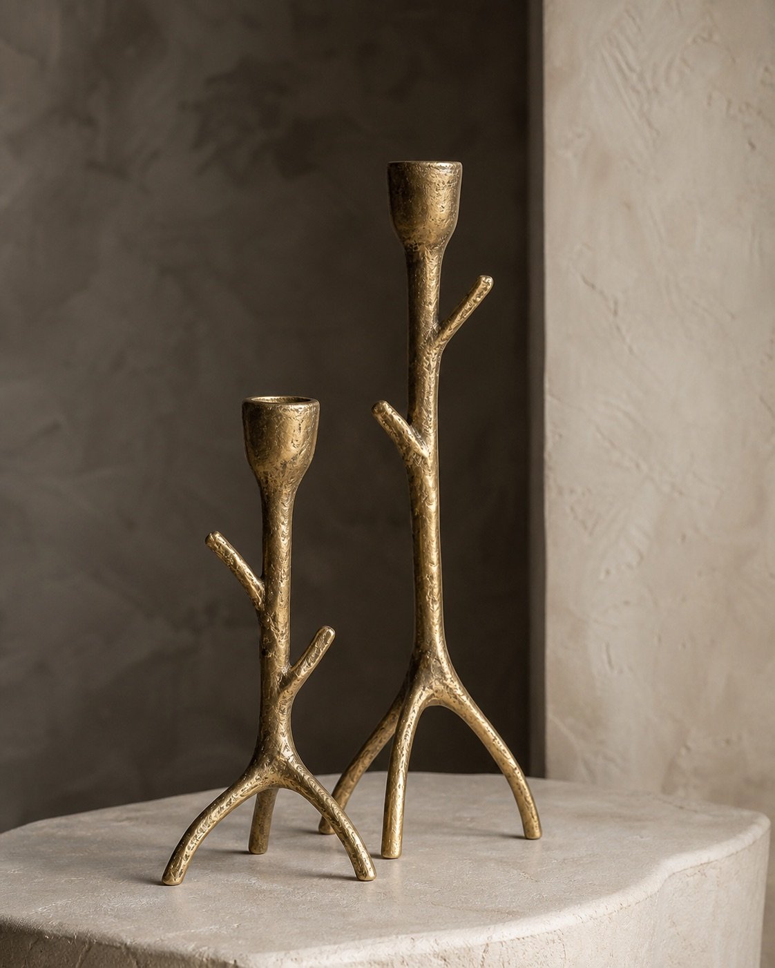 Pair of sculptural dhokra brass candleholders